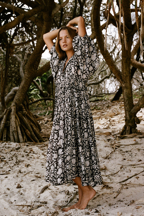 Daughters of India Kyra Midi Dress in Pepper — model on mangrove beach, hand screen print cotton