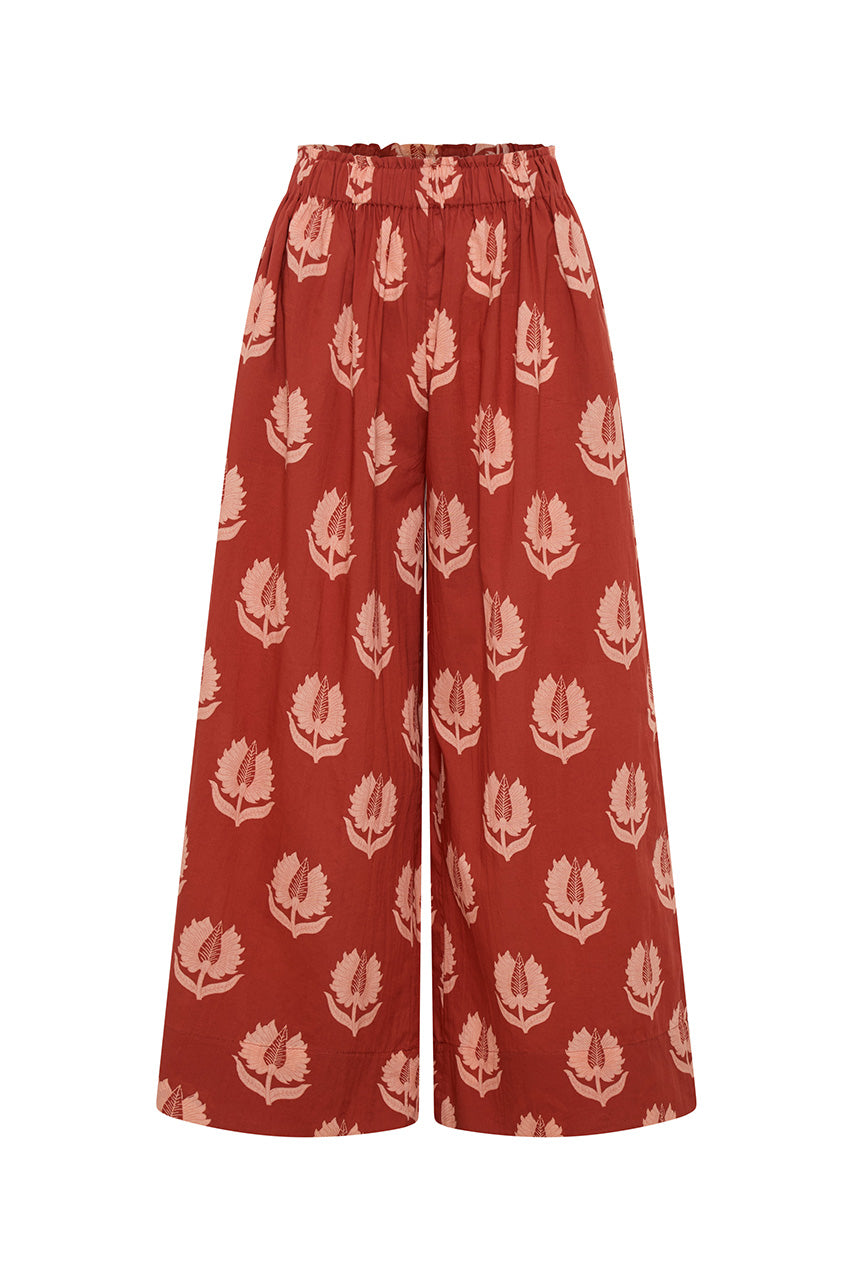 Ria Pants Ruby Red — ghost mannequin front view on white background, ruby red hand block print cotton wide-leg pants with botanical leaf motif, elastic waist, artisan Jaipur India | Daughters of India