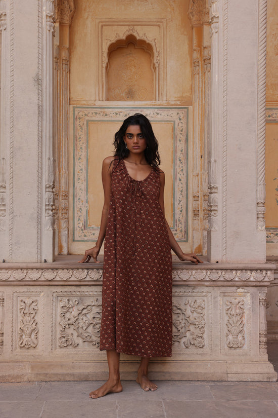 Sundress Midi Almond — studio side profile, three-quarter view, flowing A-line midi skirt, sleeveless silhouette, warm almond block print cotton sundress, artisan Jaipur India | Daughters of India